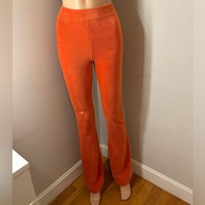Orange ribbed velvet flare leggings